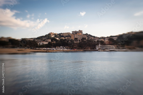 Fototapeta Naklejka Na Ścianę i Meble -  Some hotels and buildings on a sea coastline on a blue sunny sky in Costa Brava, Catalonia