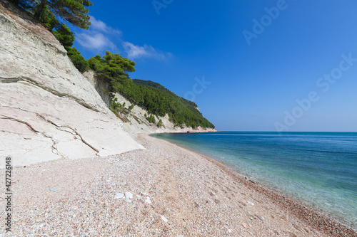 Fototapeta Naklejka Na Ścianę i Meble -  Beautiful coastline of Sassi Neri beach in riviera del Conero. Sirolo, Italy