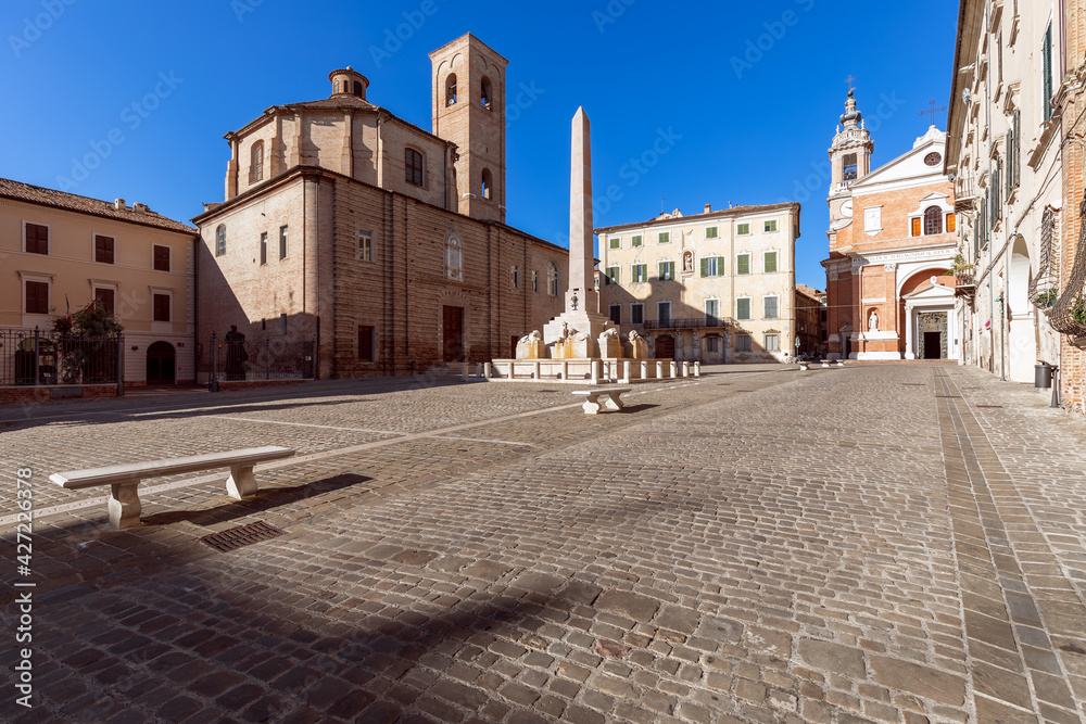 Beautiful view of square (Piazza Federico II) with the famous obelisk fountain in Jesi town. Marche, Italy