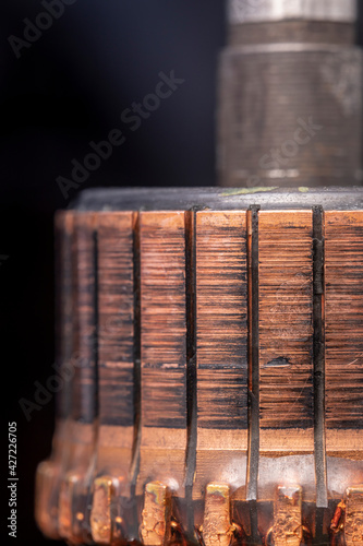 Copper commutator bar of the electric motor close up. Electric motor rotor.