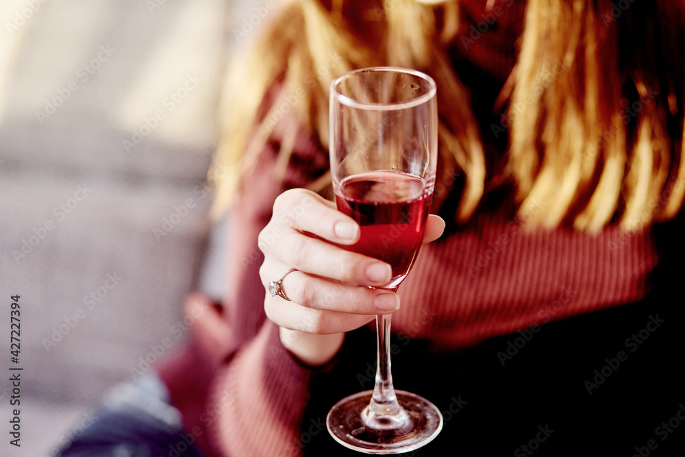 Girl with a glass of wine in the evening light Girl with a glass of wine in the evening light
