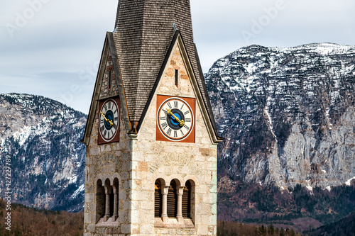 Traditional Protestant church and town view of Hallstatt mountain village and see lake against The Austrian Alps. postcard picture in Salzkammergut region, Austria 