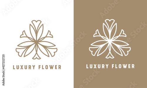 luxury flower vector logo template. thin line abstract logo type. design in light brown and white colors
