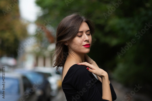 Elegant young woman with red lips