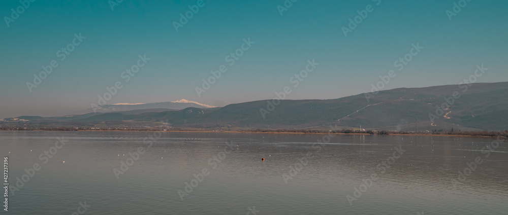 Obraz premium Panoramic view of the beautiful Lake Ulubat seen from Gölyazi in the Bursa Province, Turkey