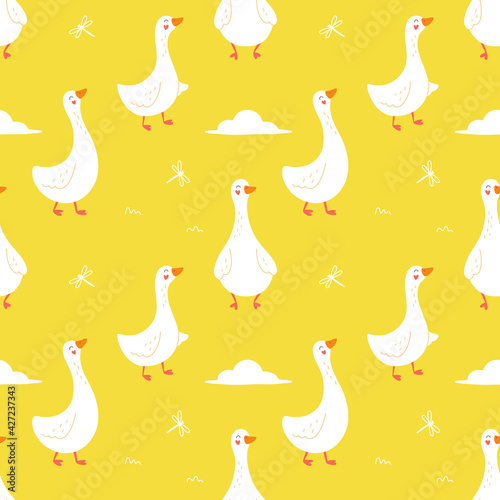 Seamless pattern of cute geese on a yellow background. Cartoon vector illustration.