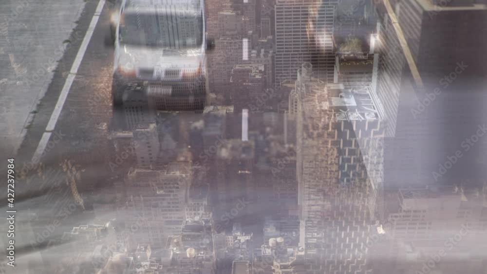 Animation of road traffic moving in fast pace over cityscape