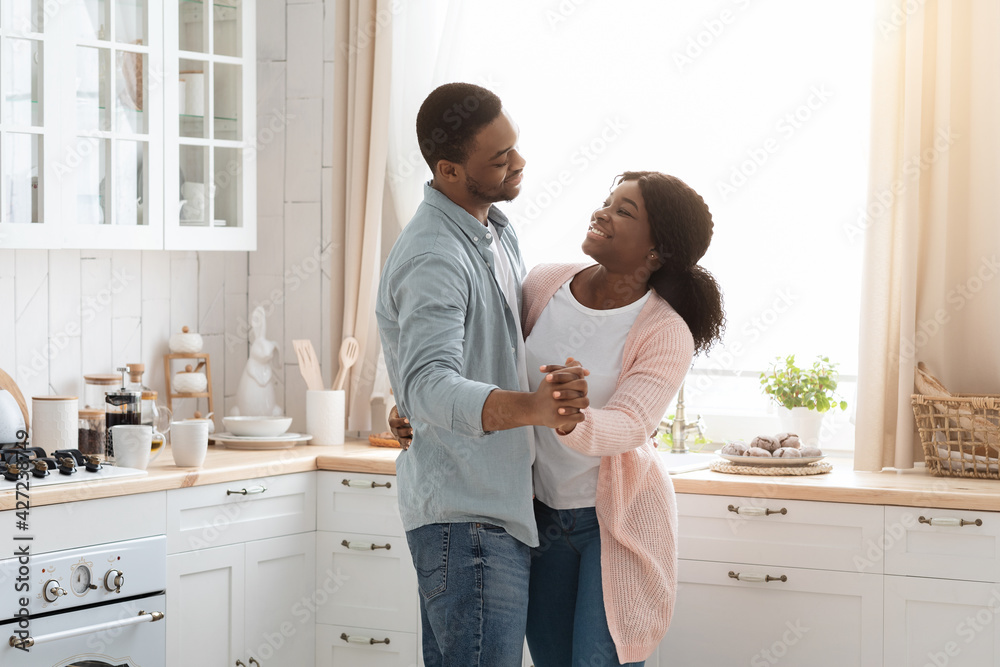 Portrait Of Romantic Young African American Couple Dancing In Kitchen Interior Portrait Of Romantic Young African American Couple Dancing In Kitchen Interior