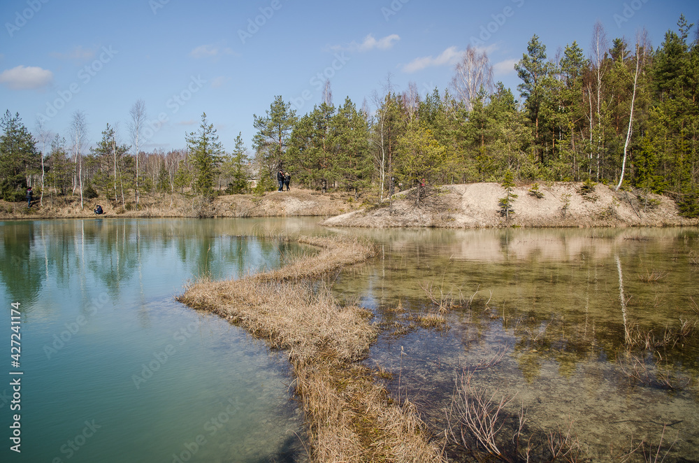 View of small green blue Lackroga lake, Latvia
