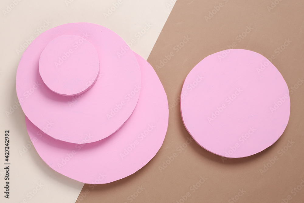 Creative background of pink circles on beige brown background. Abstract background. Flat lay. Top view Creative background of pink circles on beige brown background. Abstract background. Flat lay. Top view