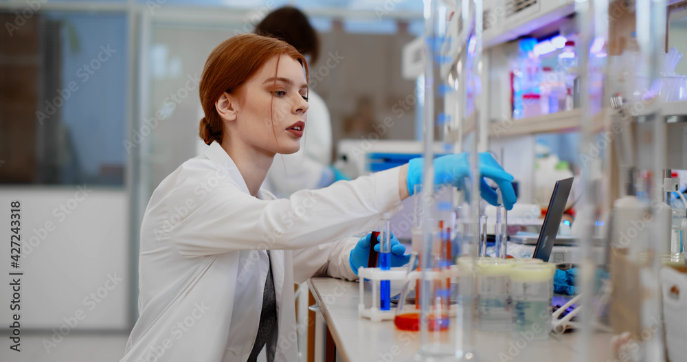 Scientist female making medical research in hospital laboratory