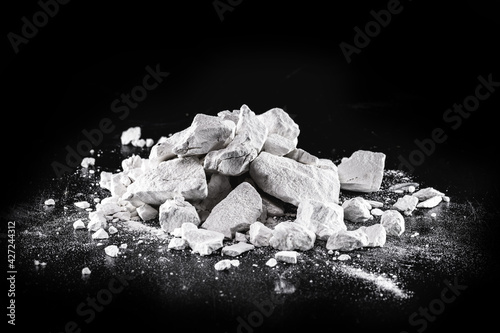Calcium and Magnesium stones, black background. Called virgin lime or quicklime photo