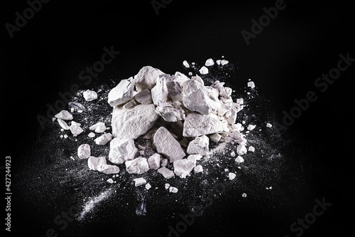 Calcium and Magnesium stones, black background. Called virgin lime or quicklime photo