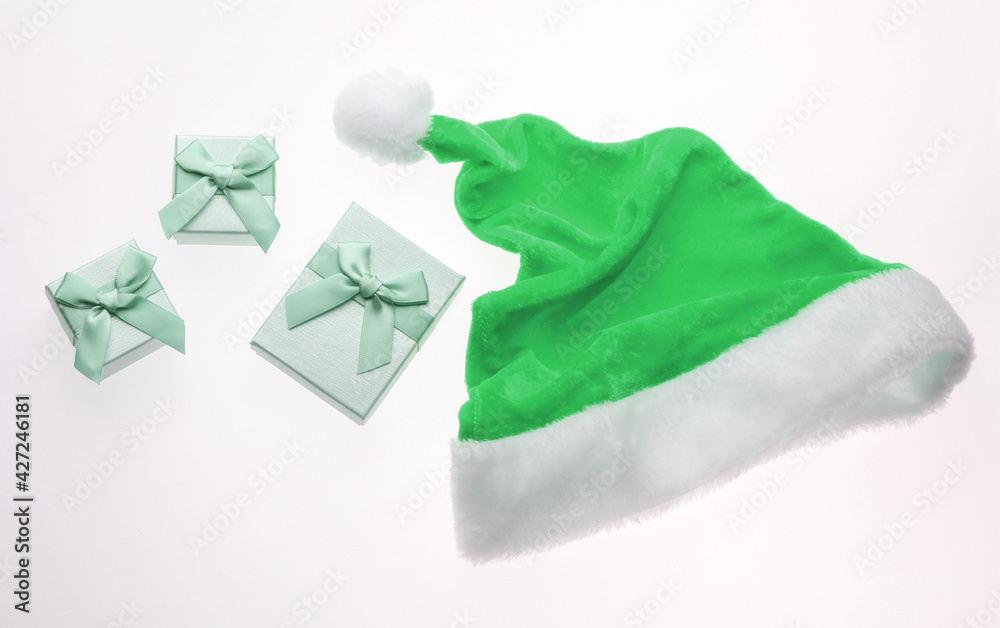 Santa hat and gift boxes with bows isolated on white background. Santa hat and gift boxes with bows isolated on white background.