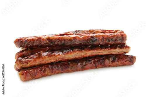 Studio shot close-up of grilled German sausages isolated on white background