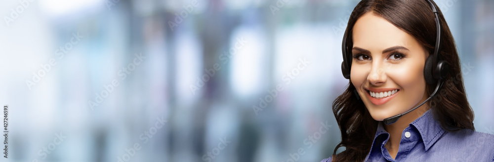 Contact Call Center Service. Customer support, female sales agent. Caller or answering phone operator or businesswoman in headset. Portrait of brunette woman indoors. Blurred modern office interior. Contact Call Center Service. Customer support, female sales agent. Caller or answering phone operator or businesswoman in headset. Portrait of brunette woman indoors. Blurred modern office interior.