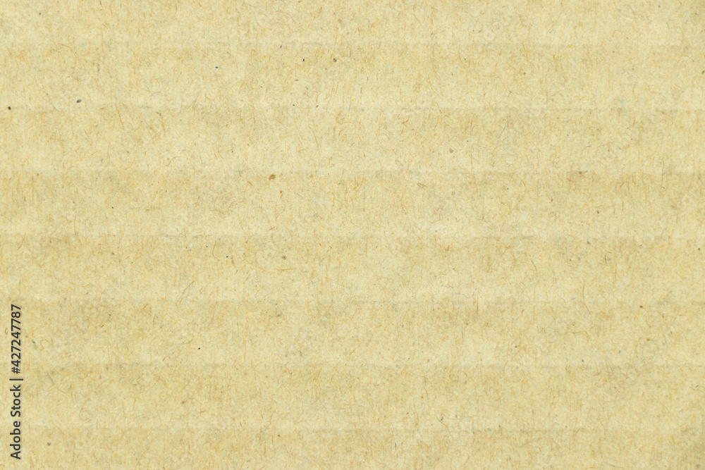 Fototapeta premium Closed up of brown color corrugated paper textured background used as wallpaper, decoration, design element