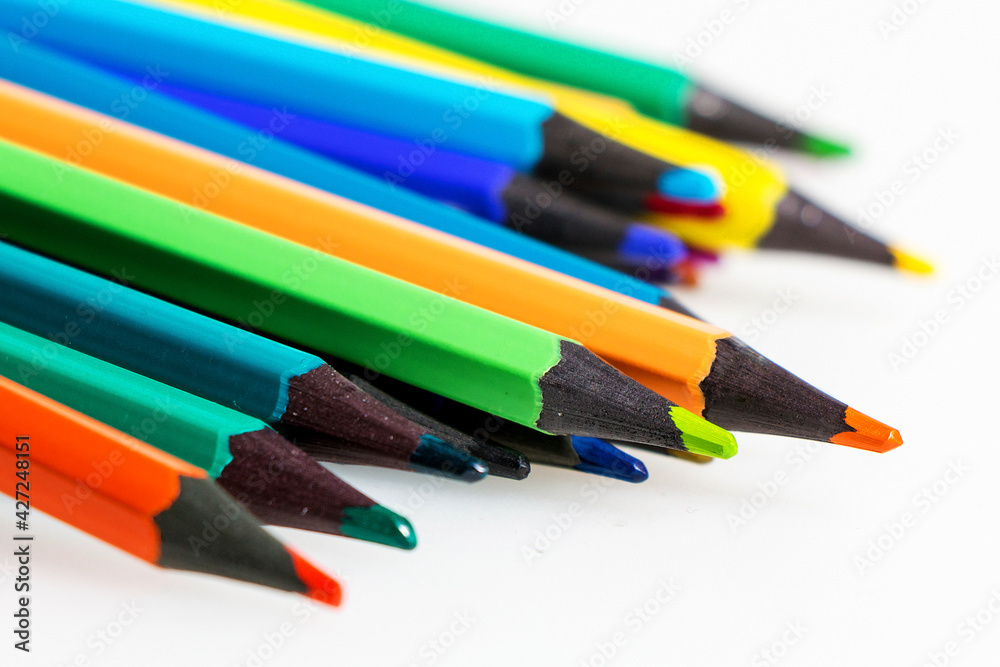 Set of colored pencils on white table Set of colored pencils on white table