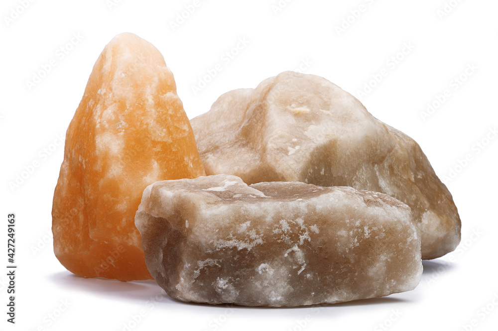 three large pieces of natural salt on a white isolated background three large pieces of natural salt on a white isolated background