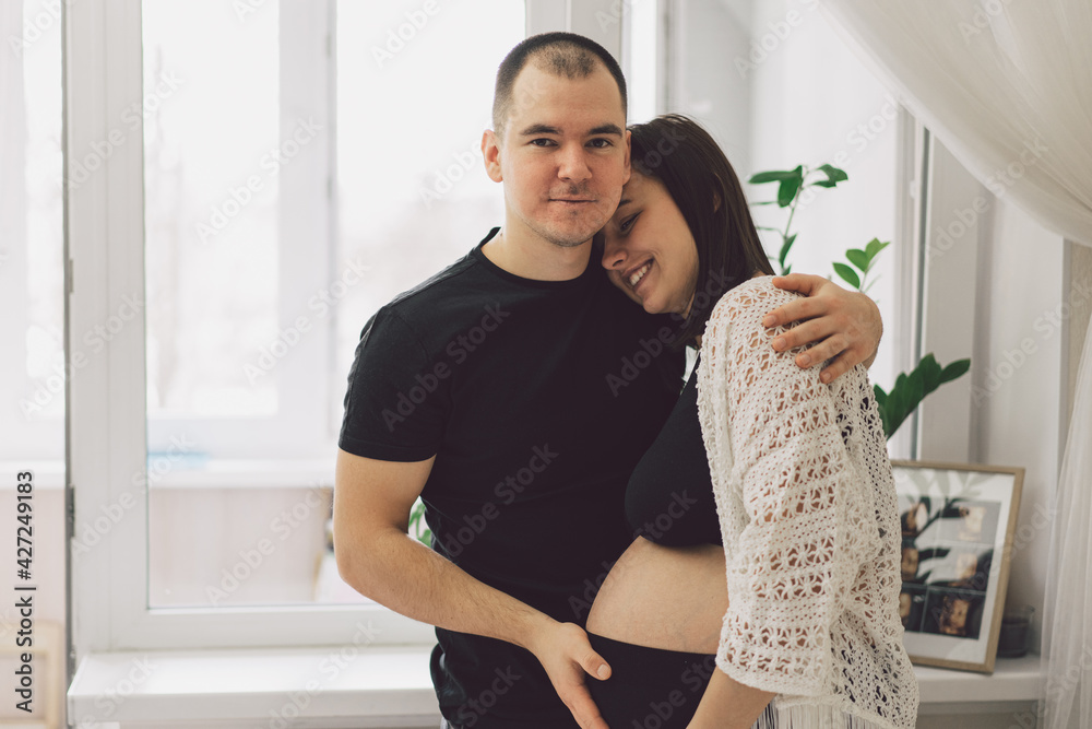 Young beautiful couple expecting a baby. Family concept Young beautiful couple expecting a baby. Family concept