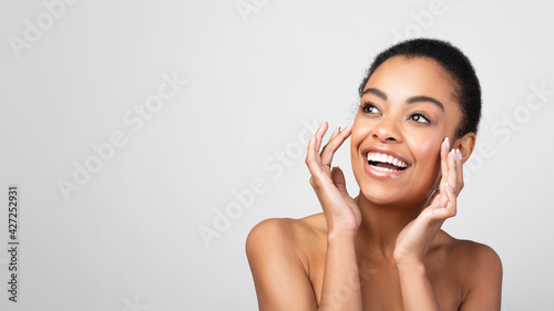African Woman Touching Face Caring For Skin, Gray Background, Panorama