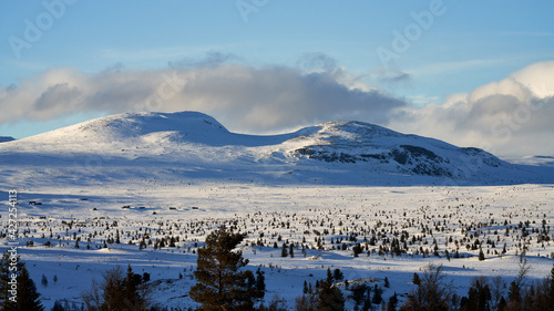 Landscape of the winter mountains in Ål, Hallingdal, Norway. Shot in April in the evening. Summer is coming, but the snow is still covering the mountains. 