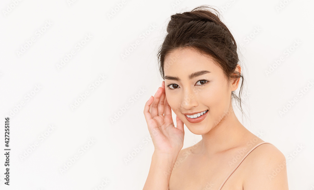 portrait of beauty asian woman with fair perfect healthy glow skin hand touching chin on white background, young beautiful asia girl with pretty smile face care. Beauty korean spa skincare. portrait of beauty asian woman with fair perfect healthy glow skin hand touching chin on white background, young beautiful asia girl with pretty smile face care. Beauty korean spa skincare.