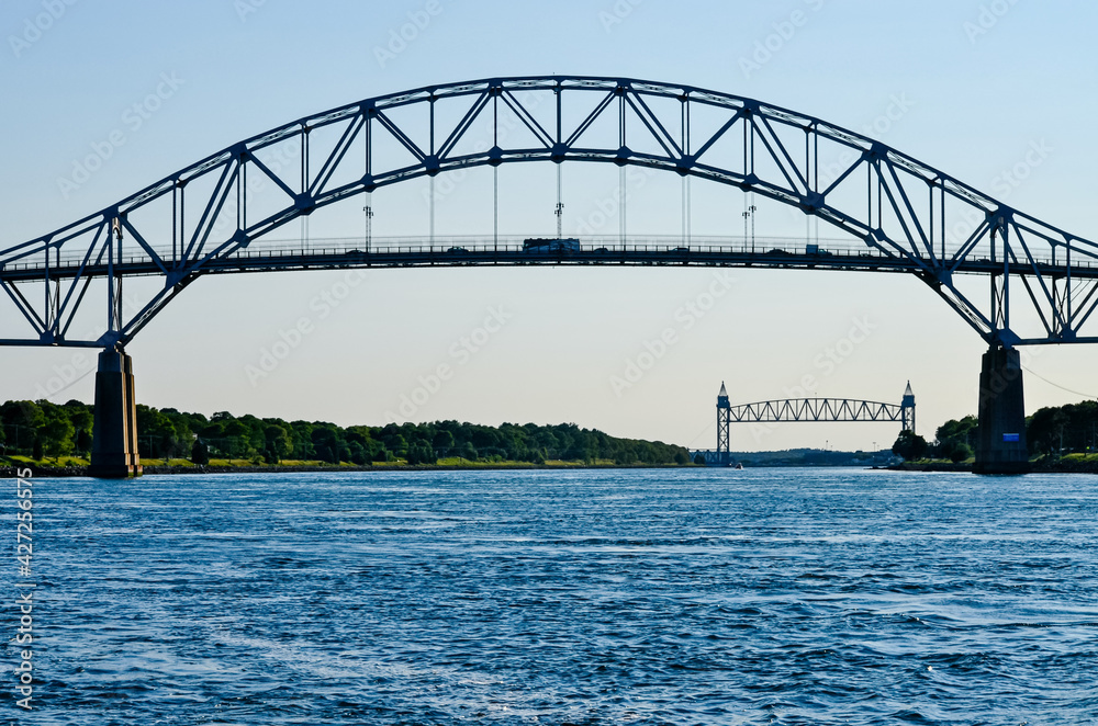 The Bourne Bridge in Bourne, Massachusetts spans the Cape Cod Canal.  Winner in 1934 of the American Institute of Steel Construction's  