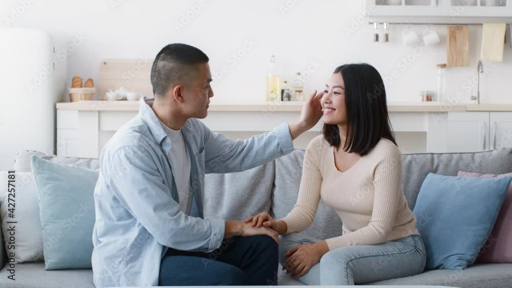 Asian Boyfriend Touching Girlfriend's Hair Talking And Flirting At Home Asian Boyfriend Touching Girlfriend's Hair Talking And Flirting At Home