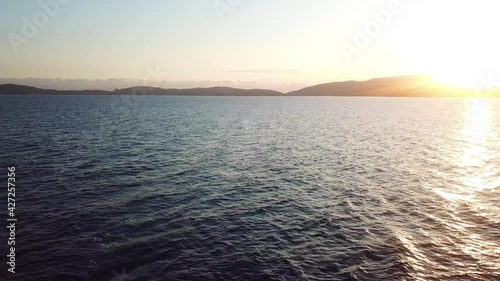 Aerial view of yacht sailing during sunset