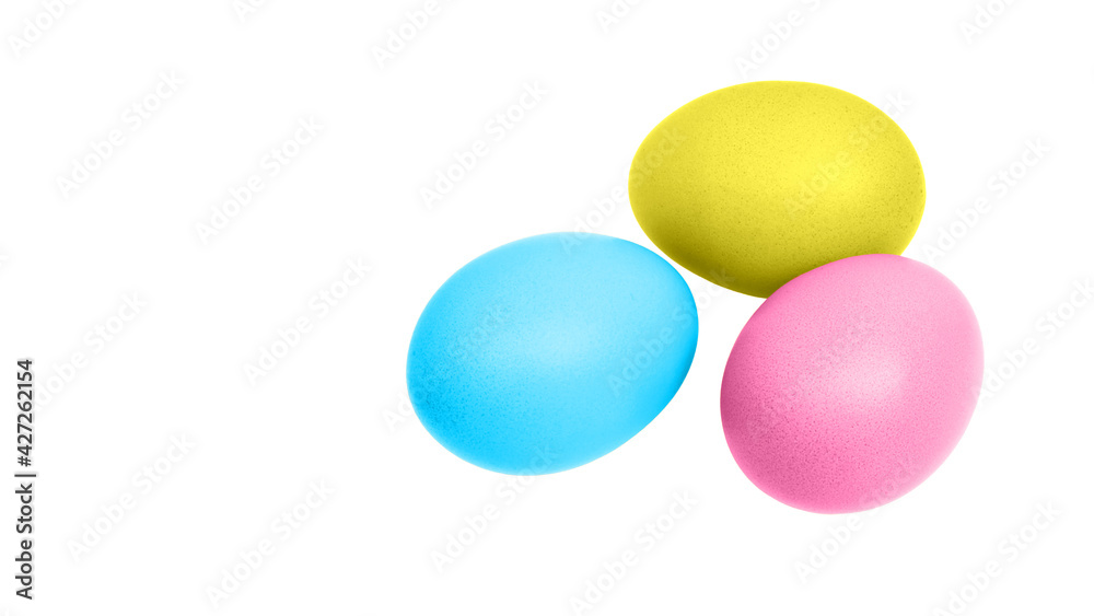 Colorful easter eggs (blue, yellow, pink) for decoration isolated on white background with copy space. Close up photo.
