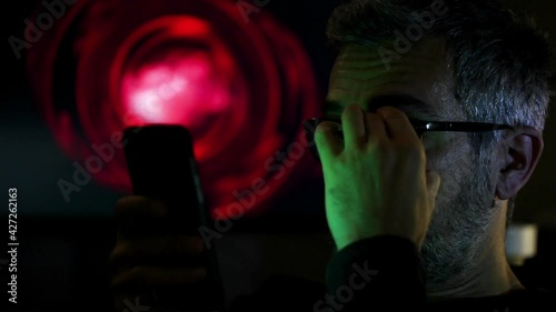 Man With Glasses Working on Computer Or Tablet