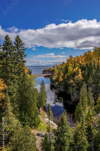 Autumn colored trees along the Baptism River where it meets Lake Superior at Tettegouche State Park  Minnesota