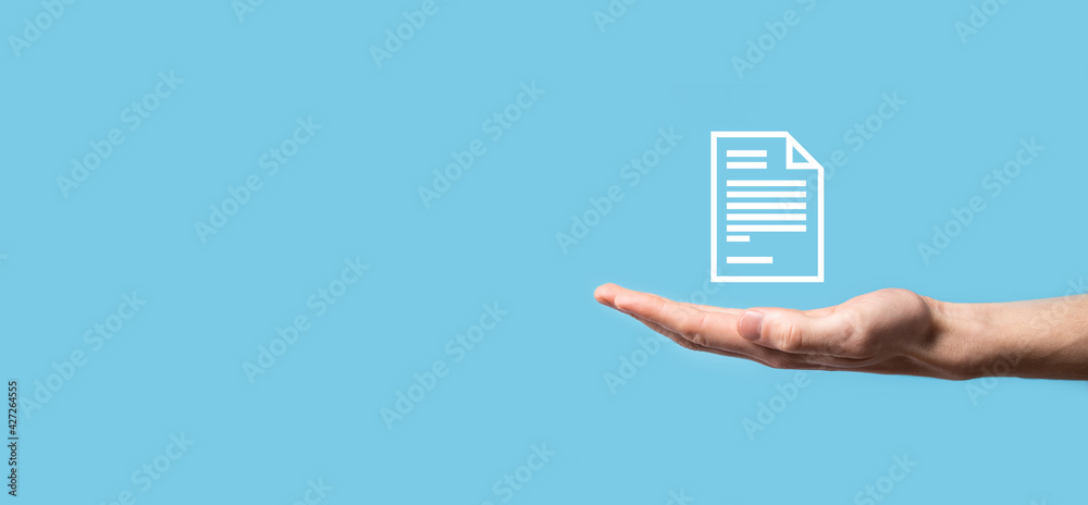 Male hand holding a document icon on blue background. Document Management Data System Business Internet Technology Concept. Corporate data management system DMS Male hand holding a document icon on blue background. Document Management Data System Business Internet Technology Concept. Corporate data management system DMS