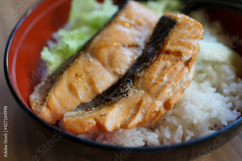 Grilled salmon rice in a bowl. Traditional Japanese food.