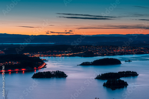 Sunset over Steinsfjorden, a branch of Lake Tyrifjorden located in Buskerud, Norway. View from Kongens Utsikt (Royal View) at Krokkleiva photo