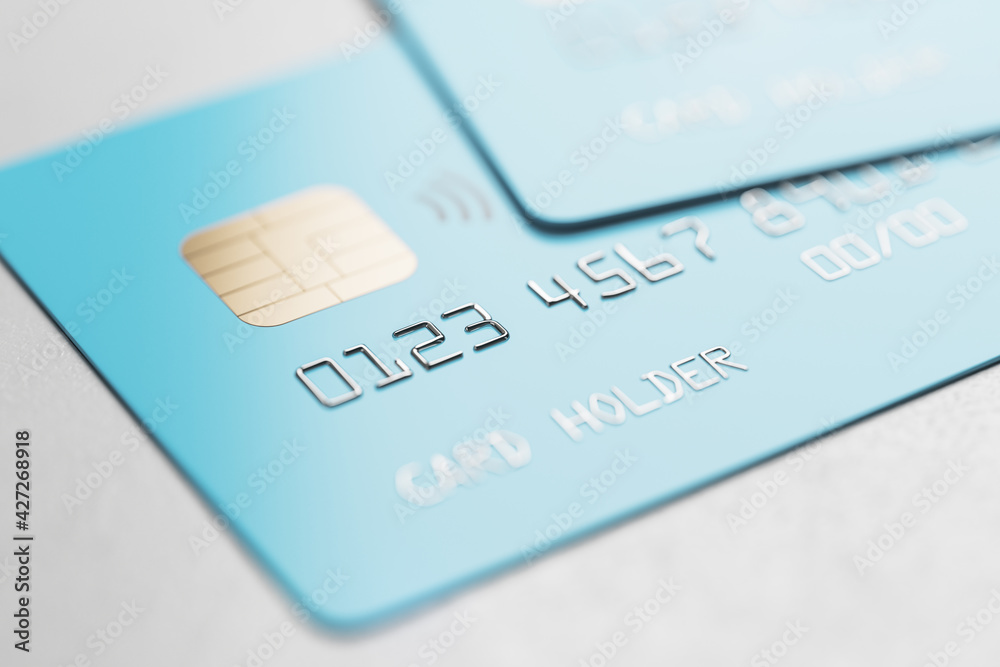 Online booking concept with bblue credit cards on light background Online booking concept with bblue credit cards on light background