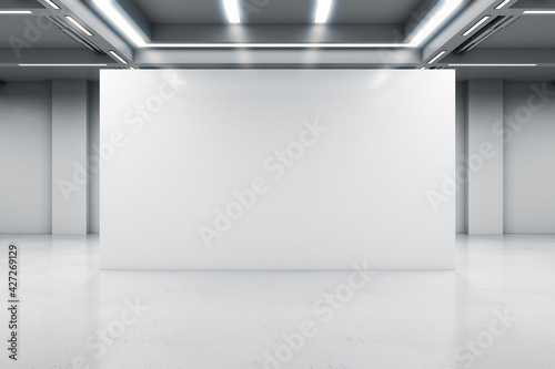 Glossy light partition with copyspace in modern industrial style hall with lamps on ceiling and concrete floor, 3D rendering, mock up