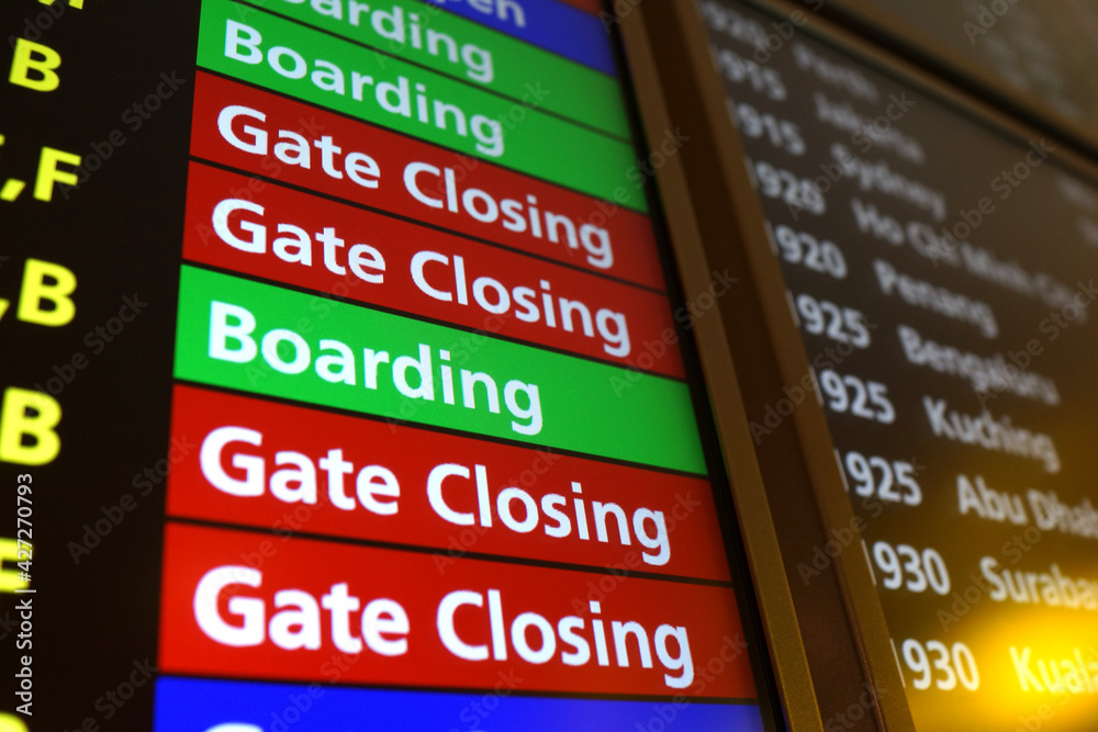 Close up airport flight connection information board. Punctuality