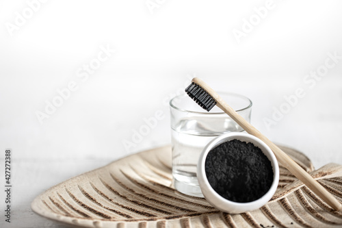 Composition with toothbrush and teeth whitening powder copy space.