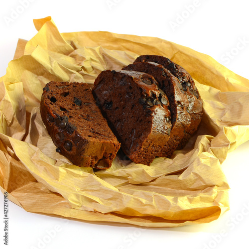 Baked bread topped with chocolate and cocoa photo