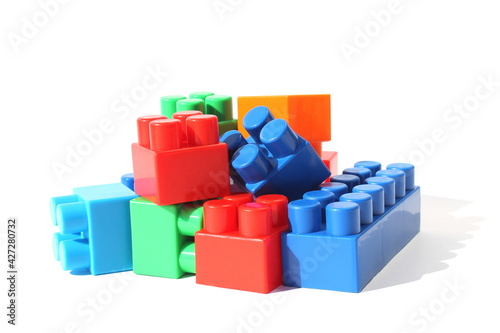 Children s bright toys in the form of blocks lie in one heap for construction.