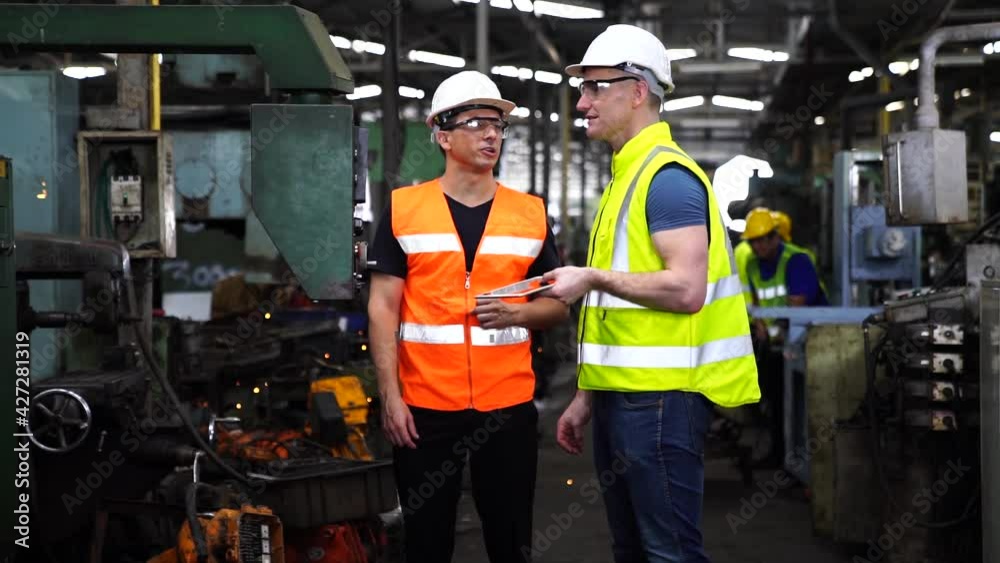 Engineers are working and repairing machines in industrial. Technician holding Measuring pliers. Scale Metal Vernier caliper measuring.