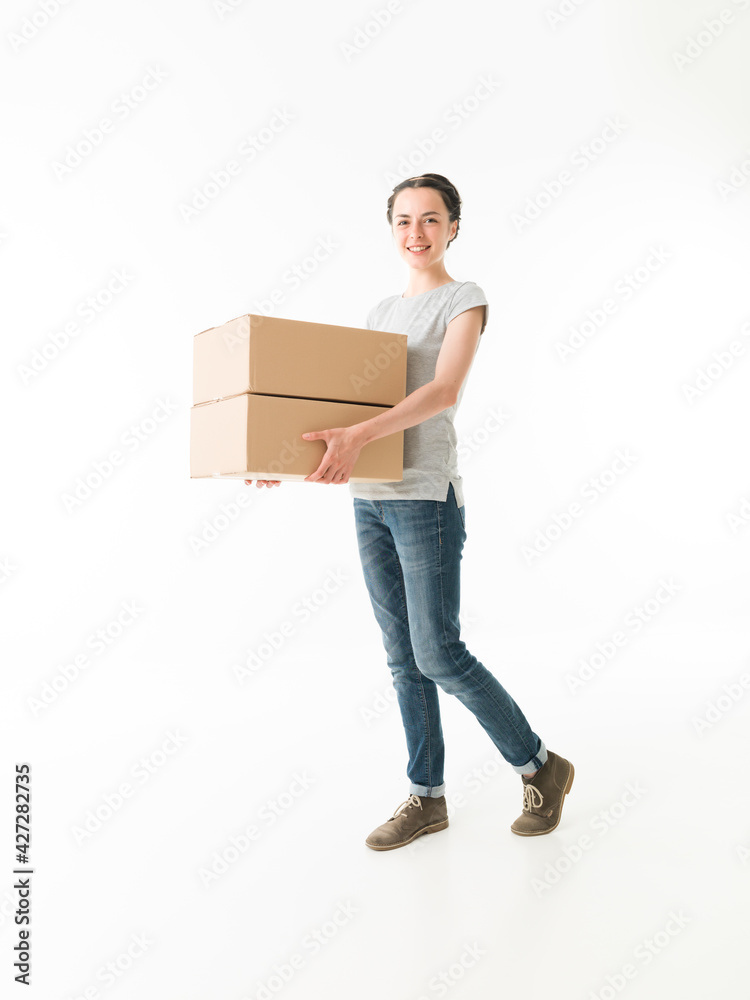 woman carrying a stack of boxes