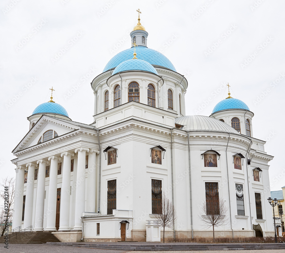 Beautiful white stone large Orthodox cathedral with blue domes.