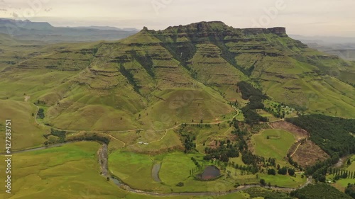 Winding Umgeni River crossing KwaZulu Natal Midlands and mountainous slopes - Aerial fly-over photo