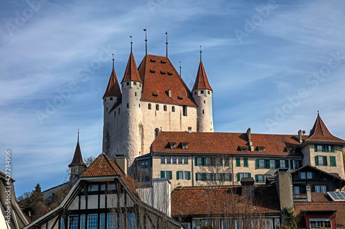 Castle towers above the roofs of the old city of Thun, Switzerland