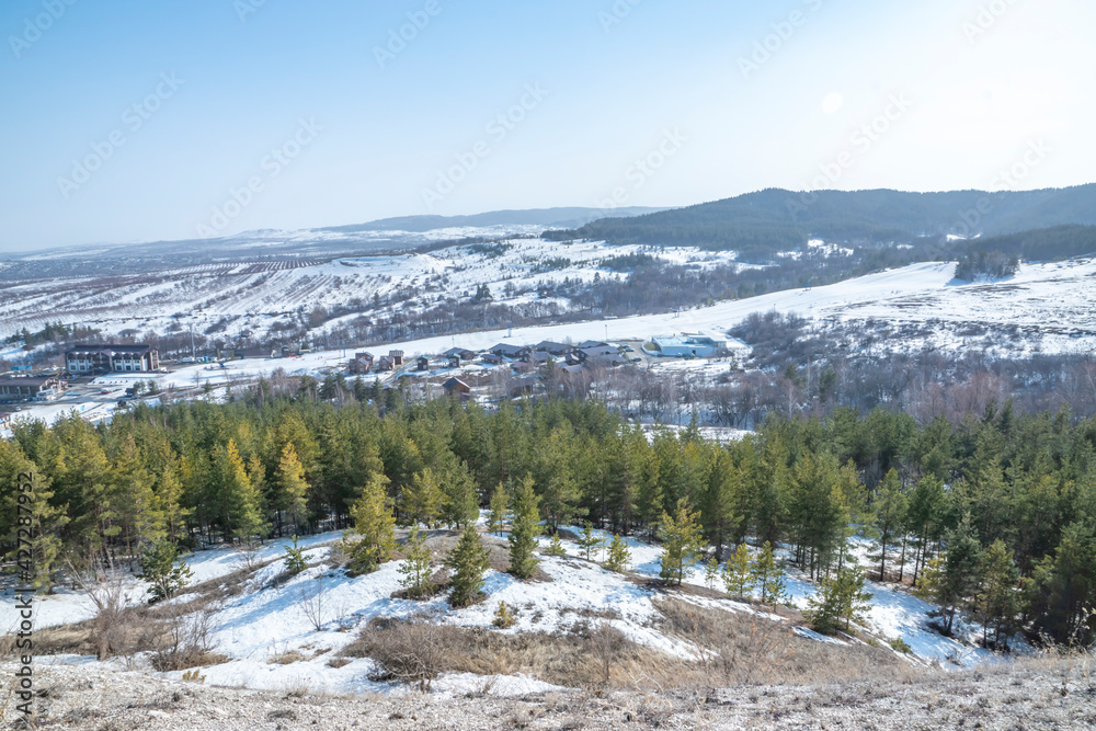spring, clear fine day, light, shade, nature, landscape, country walk, hill, hill, slope, ski slope, forest, trees, pines, snow, thaw, height, distance, space, sky, buildings, buildings, resort