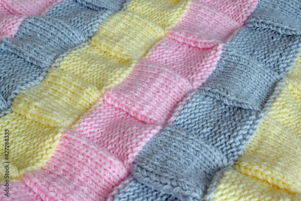 Colorful knitted background.Striped pattern.Wallpaper background. Colorful knitted background.Striped pattern.Wallpaper background.