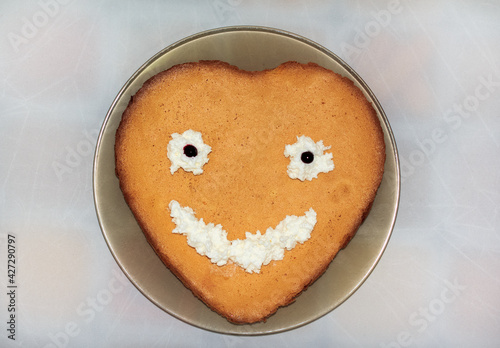 Sponge cake with cream eyes and mouth
